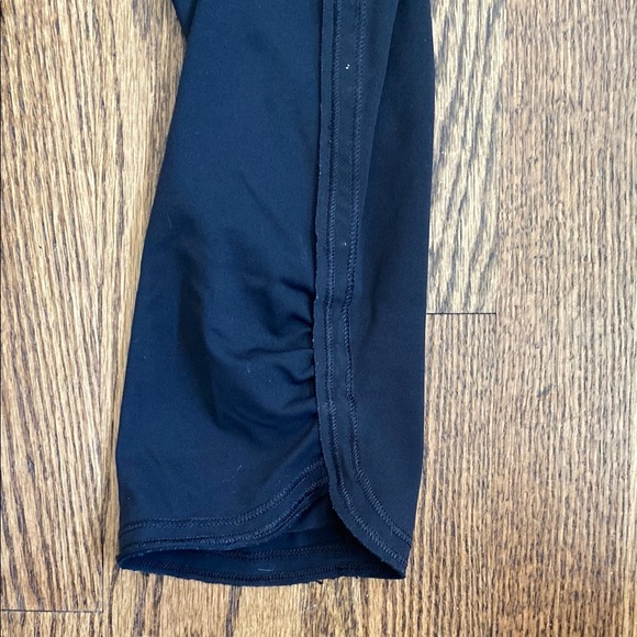 Black, cropped Lululemon leggings with pockets, ruched bottoms and zipped pocket - Picture 2 of 15